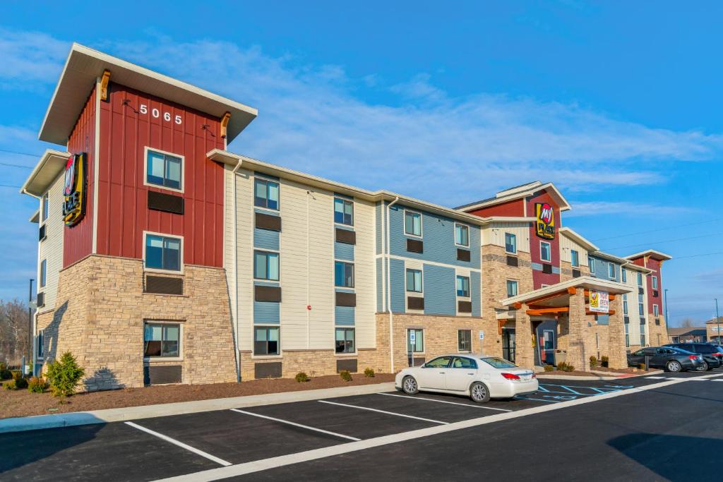 a rendering of a hotel with a car parked in a parking lot at My Place Hotel-Indianapolis Airport/Plainfield, IN in Plainfield