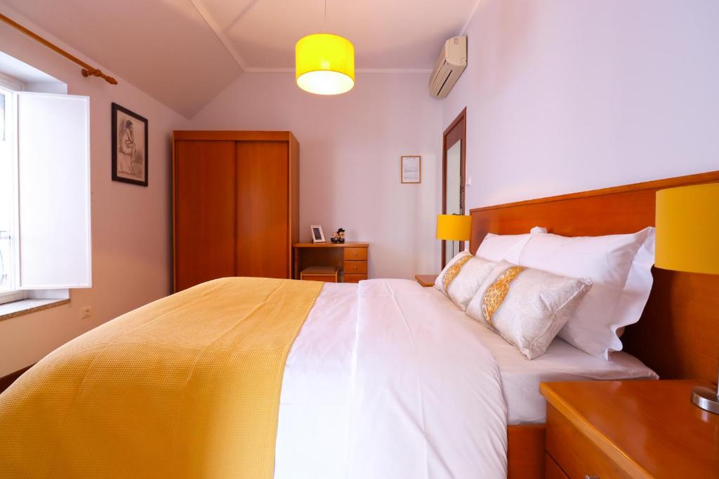 Postel nebo postele na pokoji v ubytování Dolce Vianna - City Centre Rooms