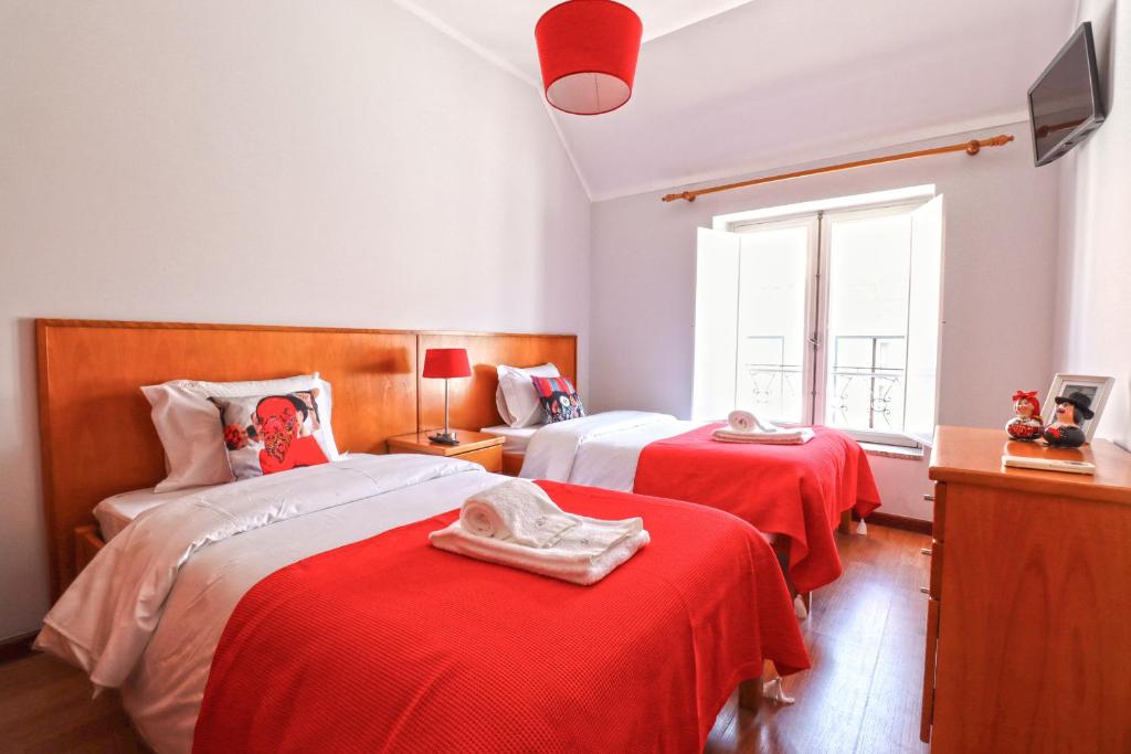 Postel nebo postele na pokoji v ubytování Dolce Vianna - City Centre Rooms