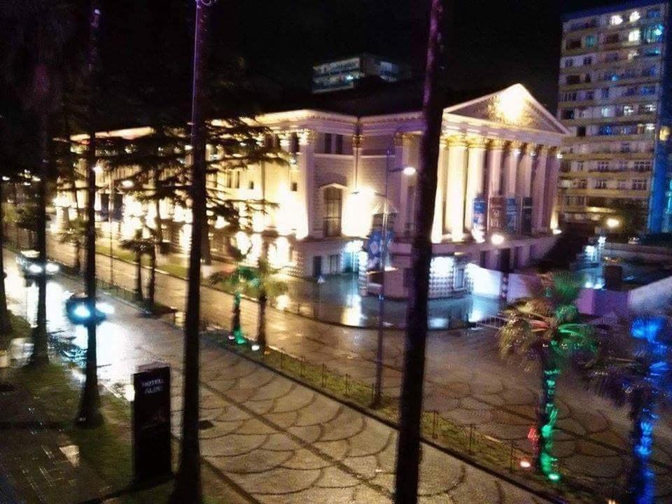 a city street at night with buildings and lights at Eka Bulvard in Batumi
