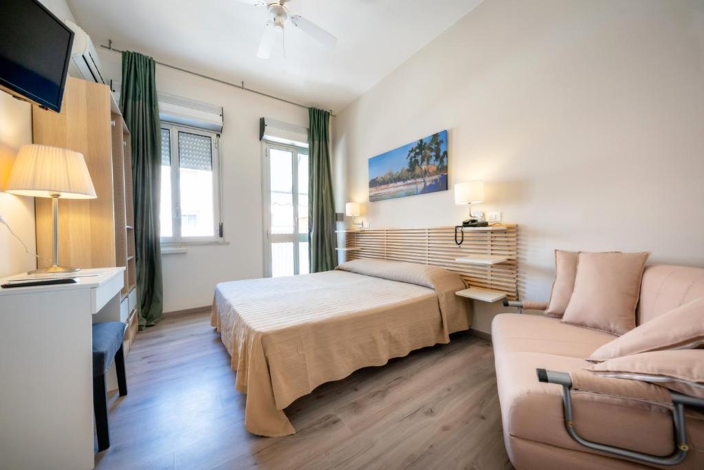 Postel nebo postele na pokoji v ubytování Hotel Firenze