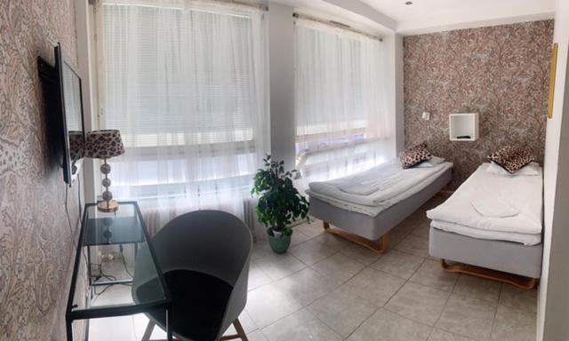 Postel nebo postele na pokoji v ubytování Hotel Harriet