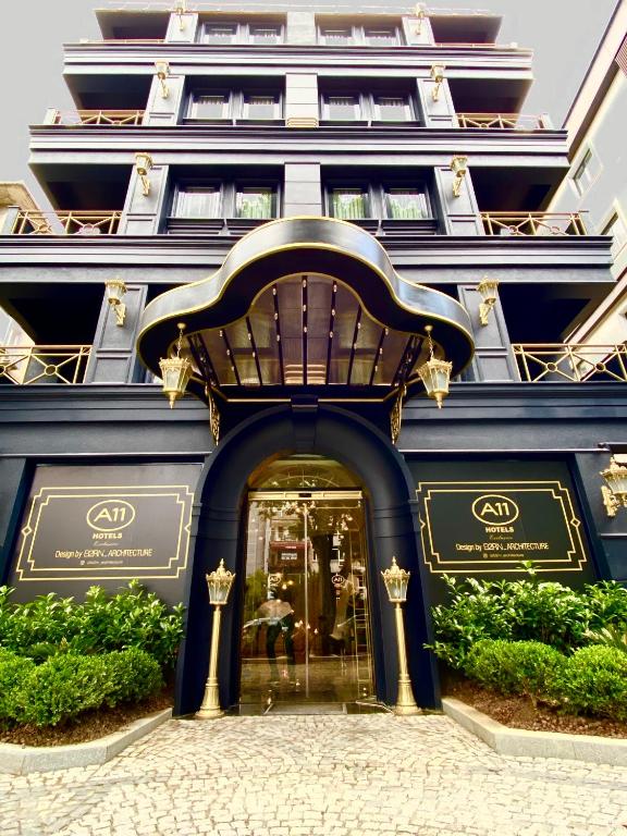 a store front of a blue building with a doorway at A11 HOTEL Exclusive in Istanbul
