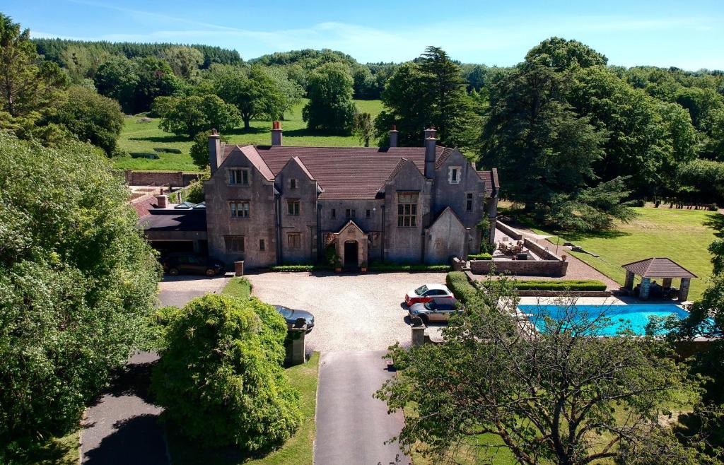 an aerial view of a large house with a pool at The Den at Backwell Down in Nailsea
