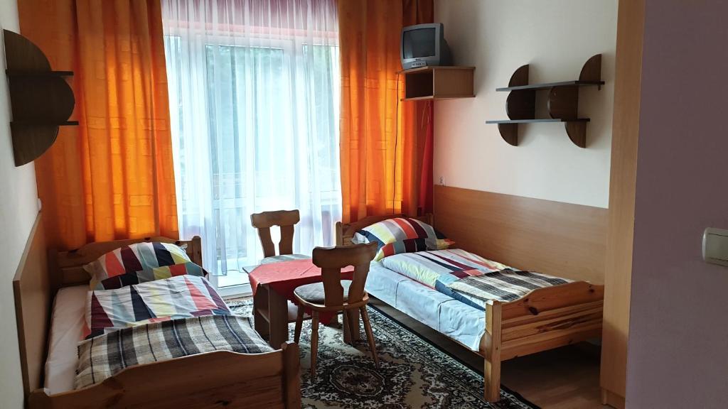 Postel nebo postele na pokoji v ubytování OKW Pilsko