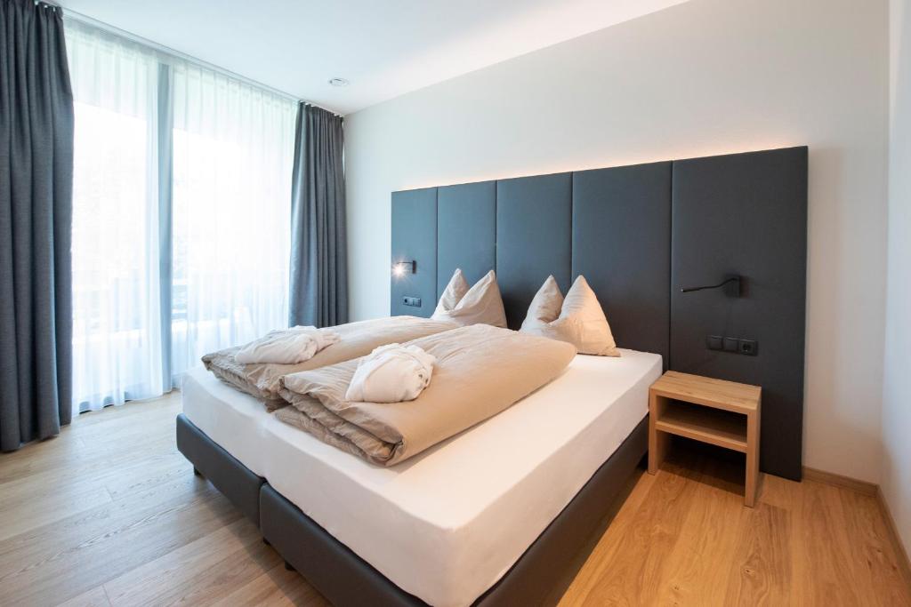 Postel nebo postele na pokoji v ubytování Premium Apartments Faselehof