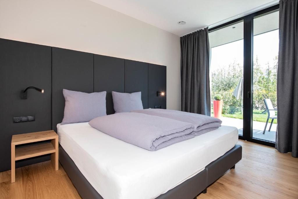 Postel nebo postele na pokoji v ubytování Premium Apartments Faselehof