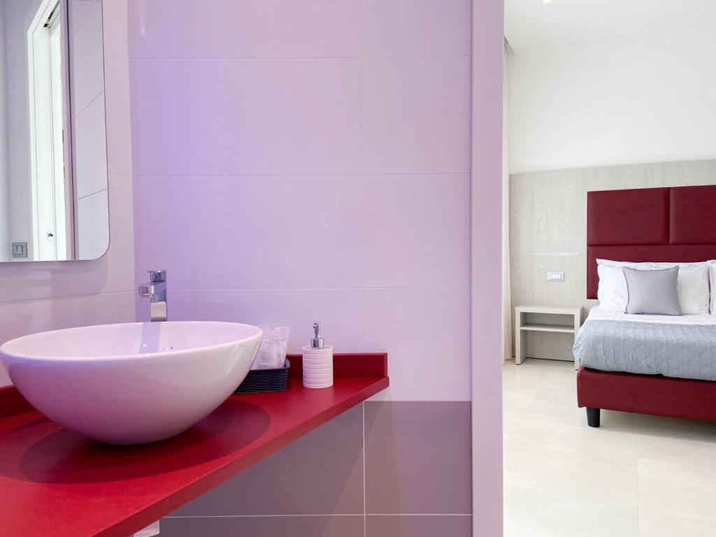 Ένα ή περισσότερα κρεβάτια σε δωμάτιο στο Edison Hotel Seaview & SPA