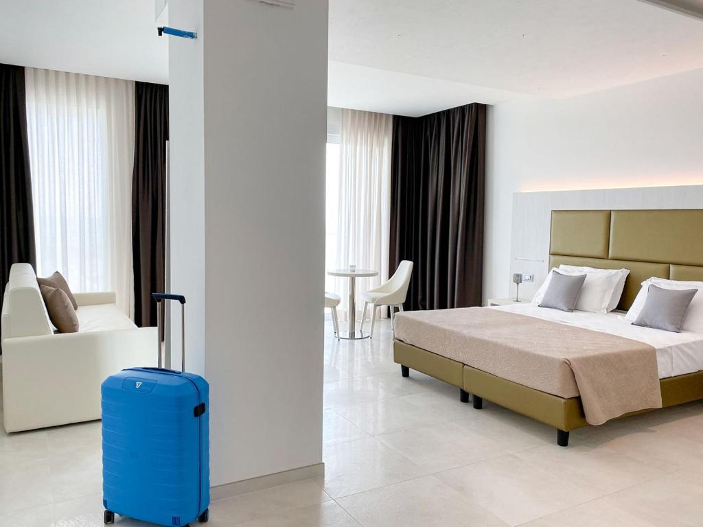 Ένα ή περισσότερα κρεβάτια σε δωμάτιο στο Edison Hotel Seaview & SPA