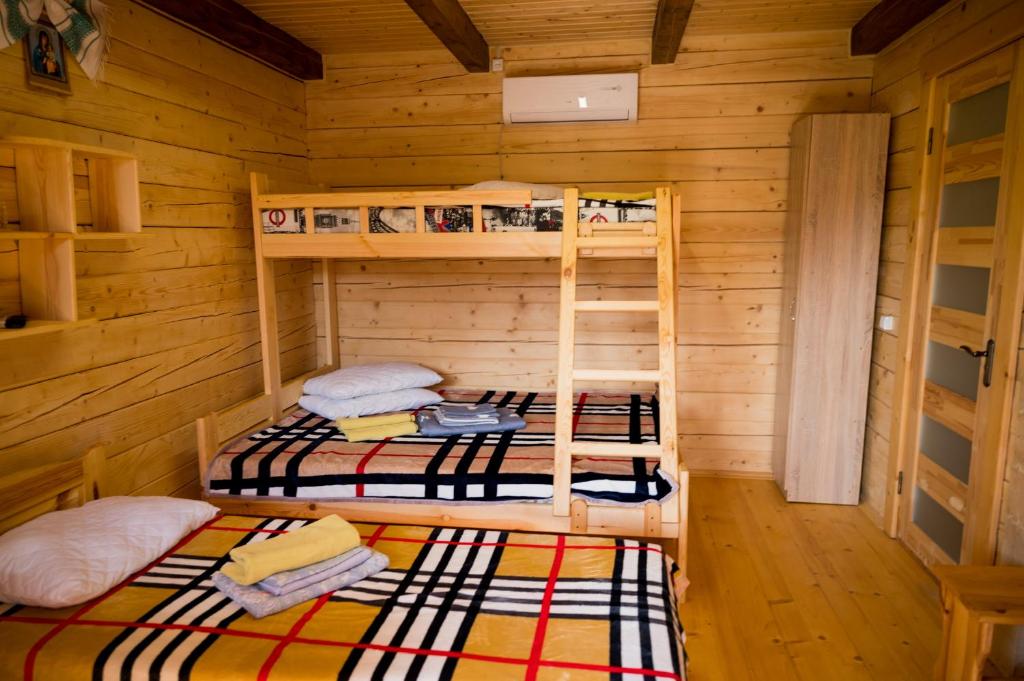 Postel nebo postele na pokoji v ubytování Rybatska 7