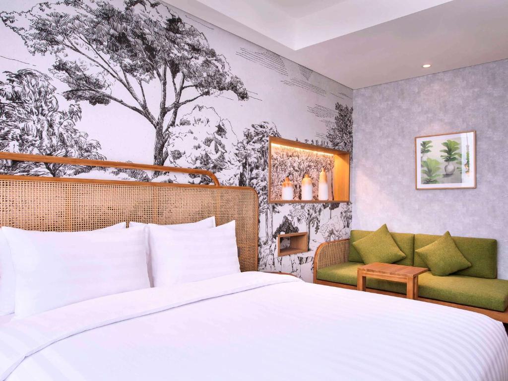 Letto o letti in una camera di Mercure Tangerang BSD City