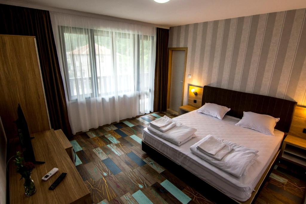 Postel nebo postele na pokoji v ubytování Veykata Resort & Spa