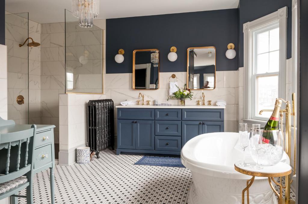 a bathroom with a blue cabinet and a sink at Slaymaker & Nichols Gastro House & Inn in Charlottetown