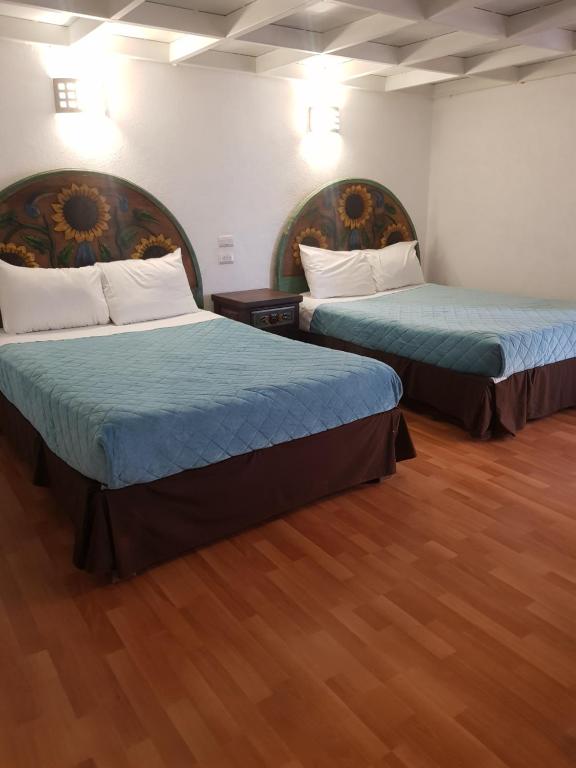 Postel nebo postele na pokoji v ubytování Hotel Meson Mariano Matamoros