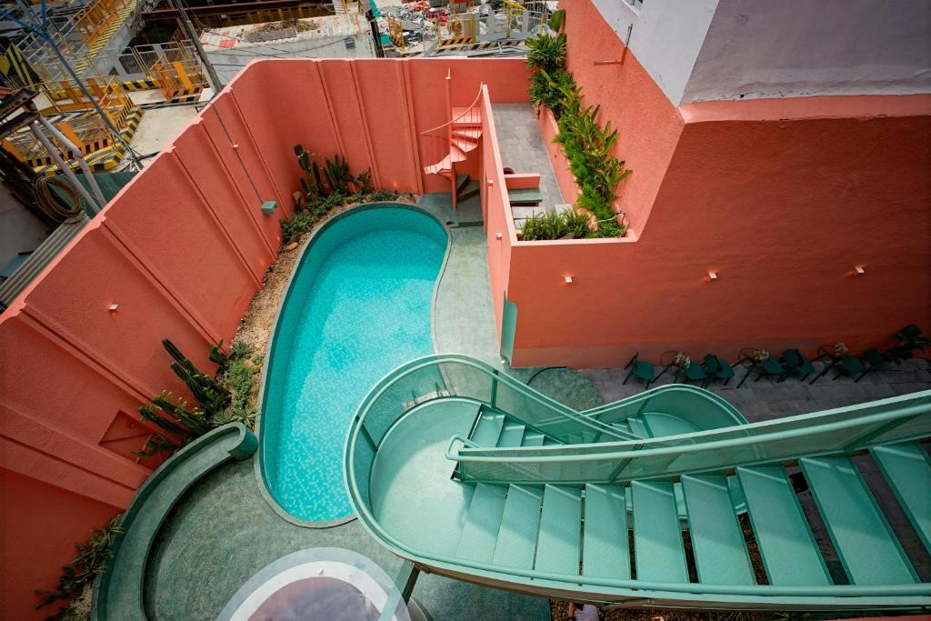 an overhead view of a slide at a water park at La Memoria Hotel - City Centre in Ho Chi Minh City