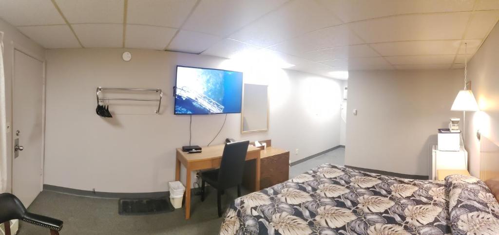 Postel nebo postele na pokoji v ubytování Sunset Motel