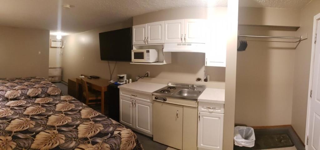 Kuchyň nebo kuchyňský kout v ubytování Sunset Motel