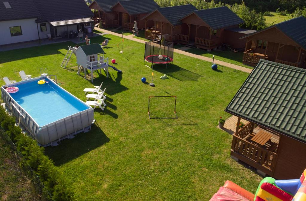 an aerial view of a backyard with a pool at Delfinek in Darłowo
