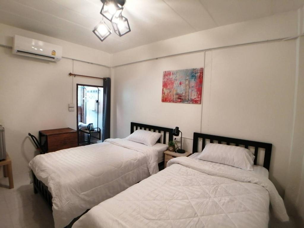 Posteľ alebo postele v izbe v ubytovaní GoGoal Latkrabang