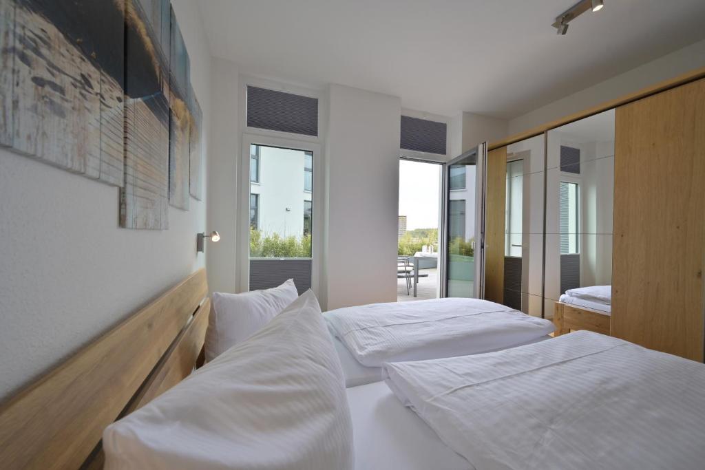 Cama ou camas em um quarto em Ferienwohnung Sonnenterrasse