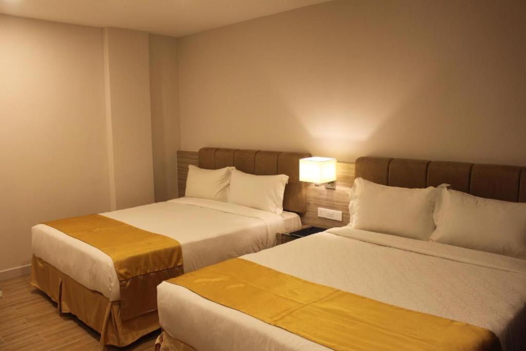 Postel nebo postele na pokoji v ubytování NU Hotel @ KL Sentral