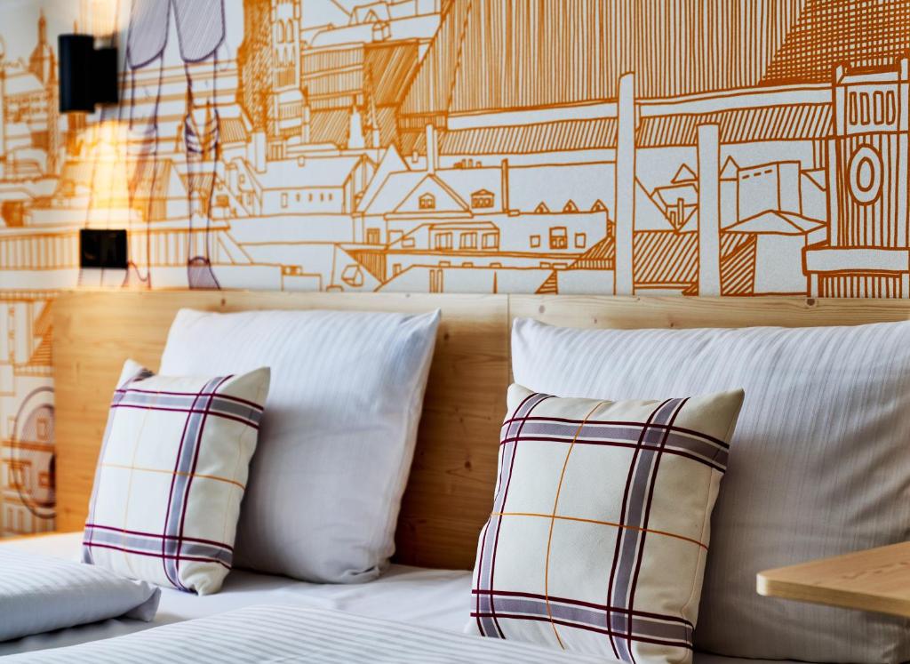 Postel nebo postele na pokoji v ubytování McDreams Hotel München - Messe