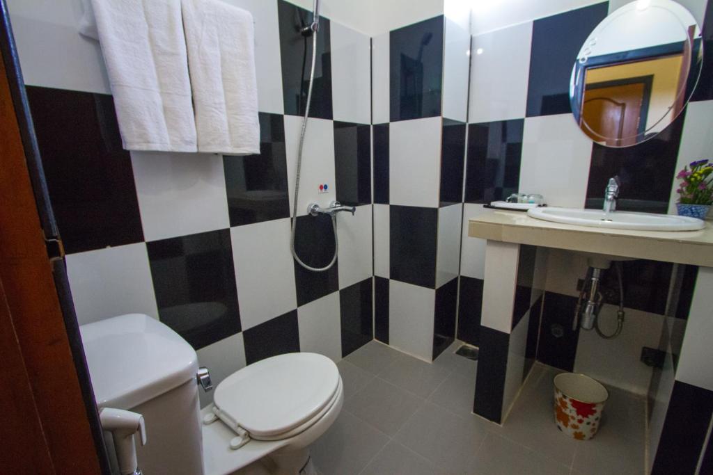 Koupelna v ubytování Botoum Hotel
