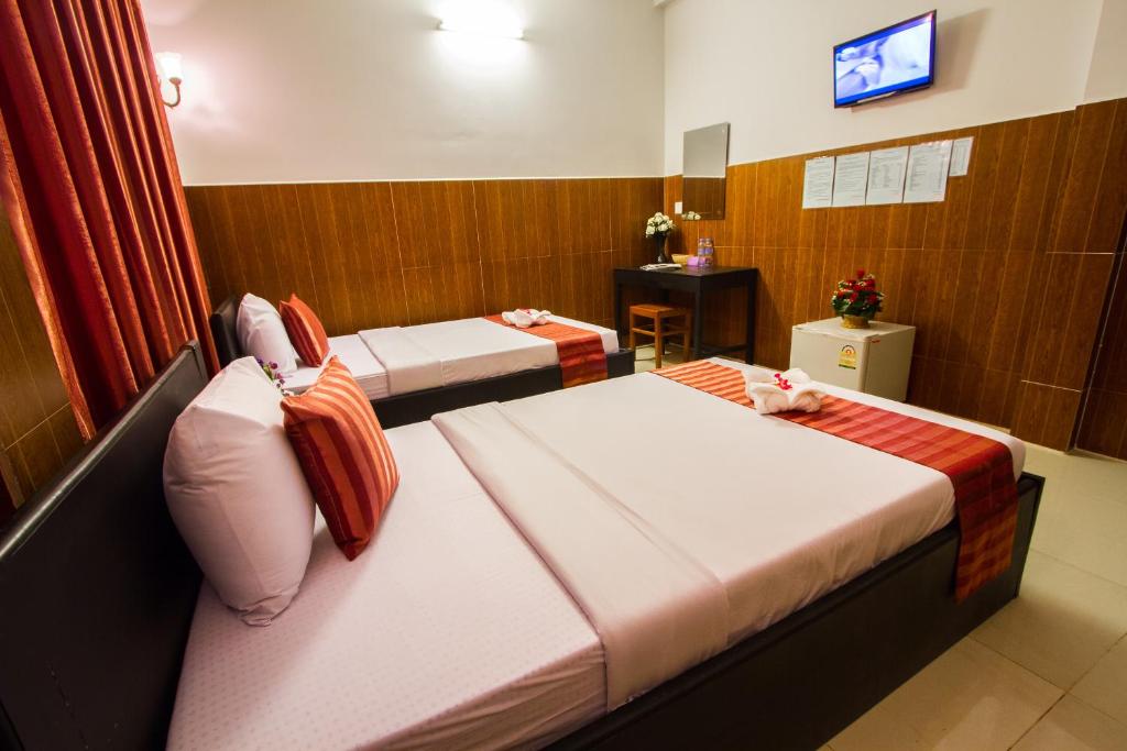 TV a/nebo společenská místnost v ubytování Botoum Hotel