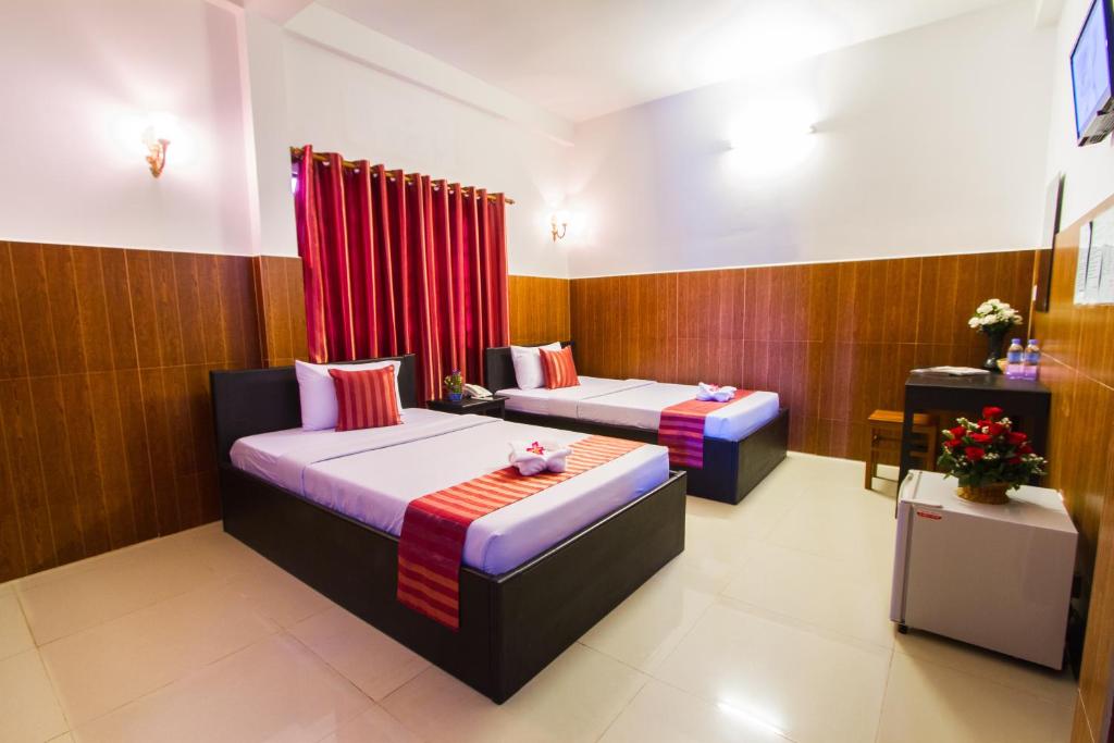 Postel nebo postele na pokoji v ubytování Botoum Hotel