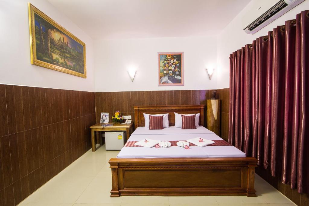 Postel nebo postele na pokoji v ubytování Botoum Hotel