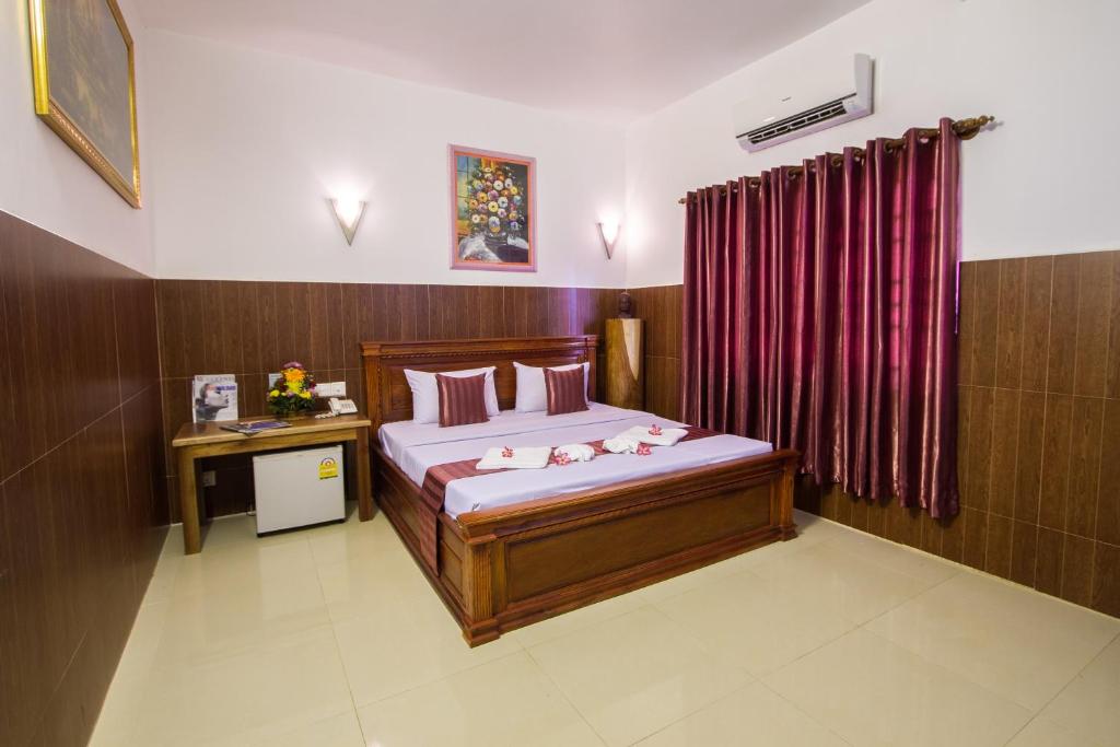 Postel nebo postele na pokoji v ubytování Botoum Hotel
