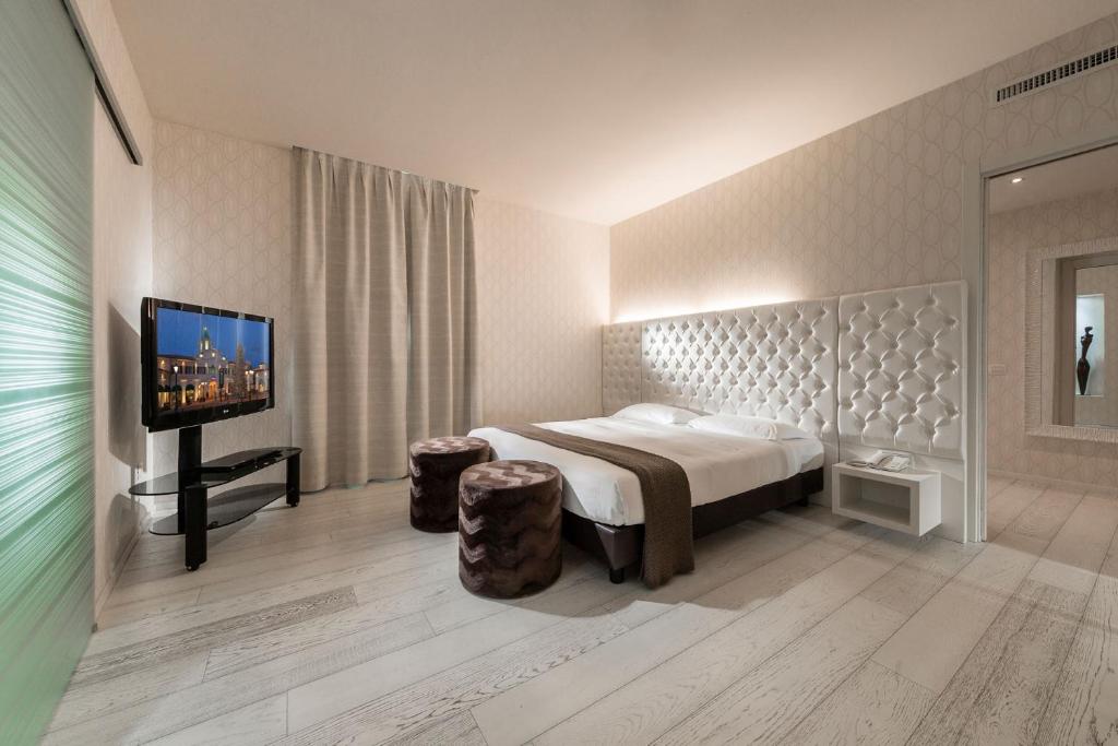 Postel nebo postele na pokoji v ubytování Base Hotel