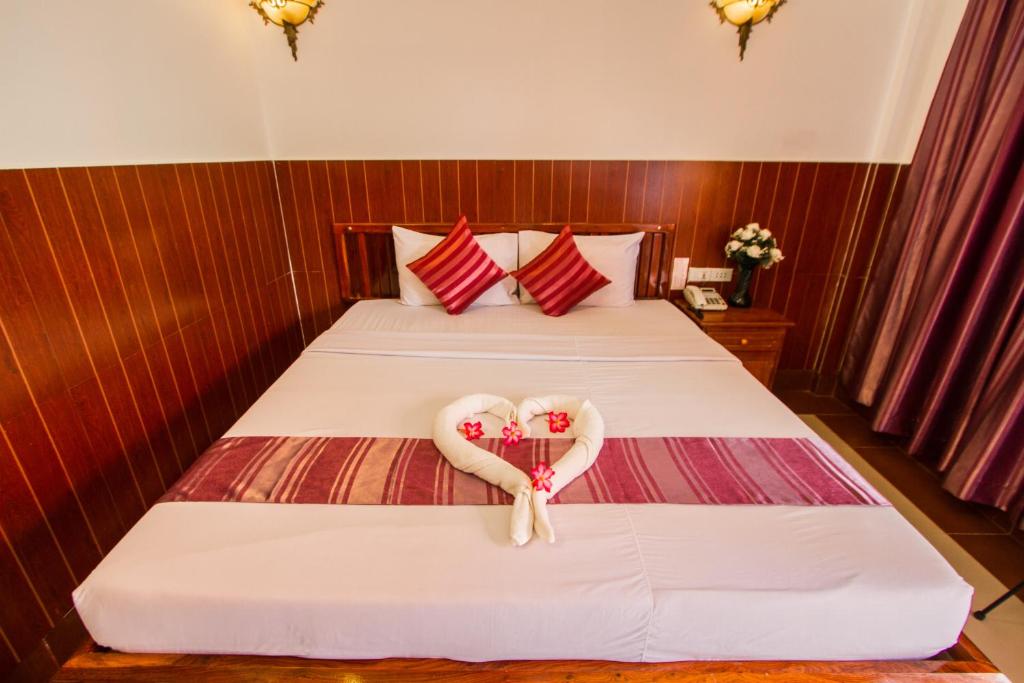 Postel nebo postele na pokoji v ubytování Botoum Hotel