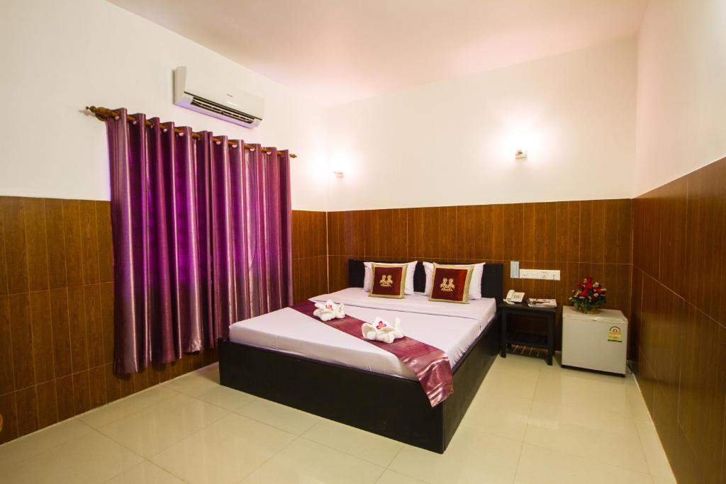 Postel nebo postele na pokoji v ubytování Botoum Hotel
