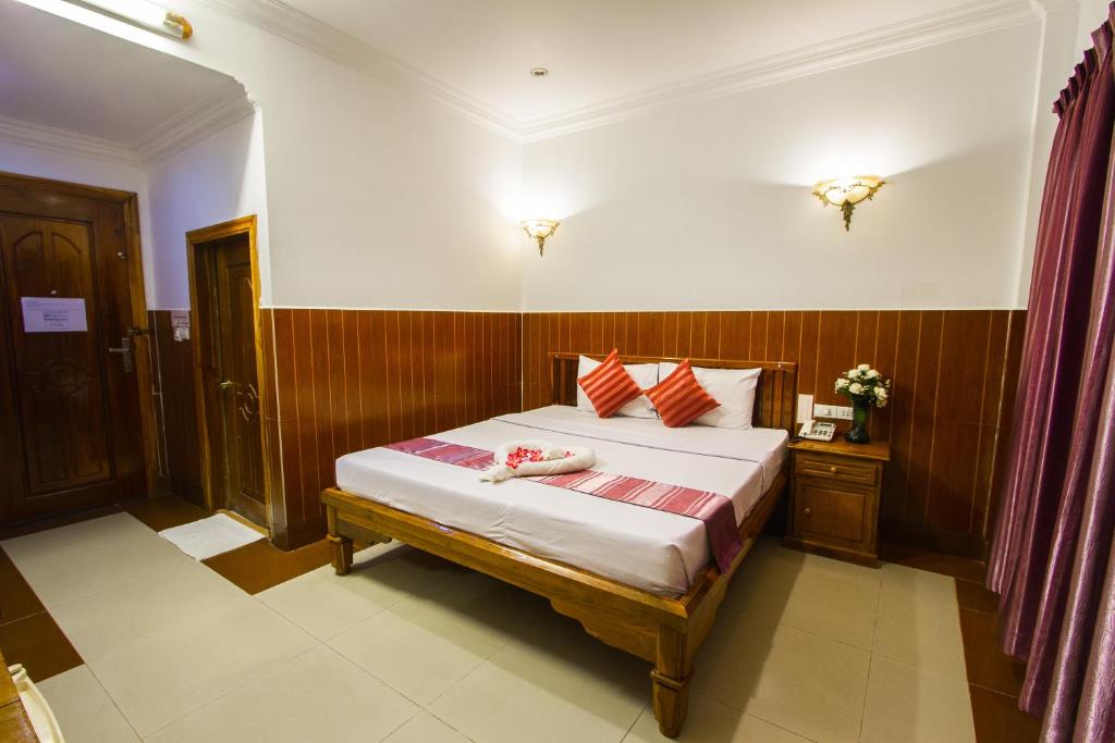Postel nebo postele na pokoji v ubytování Botoum Hotel