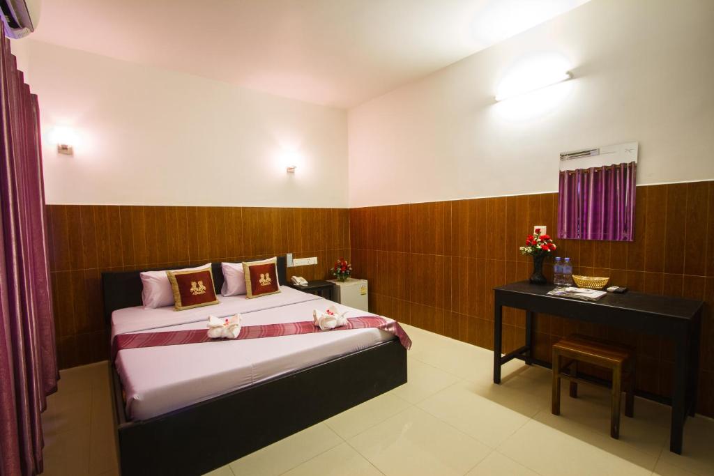 Postel nebo postele na pokoji v ubytování Botoum Hotel