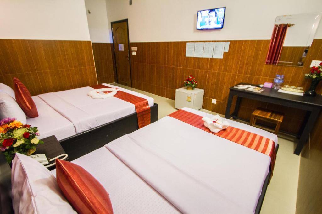 Postel nebo postele na pokoji v ubytování Botoum Hotel
