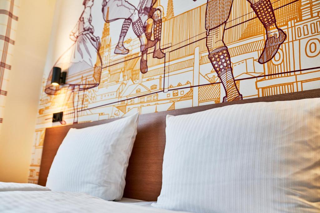 Postel nebo postele na pokoji v ubytování McDreams Hotel München - Messe