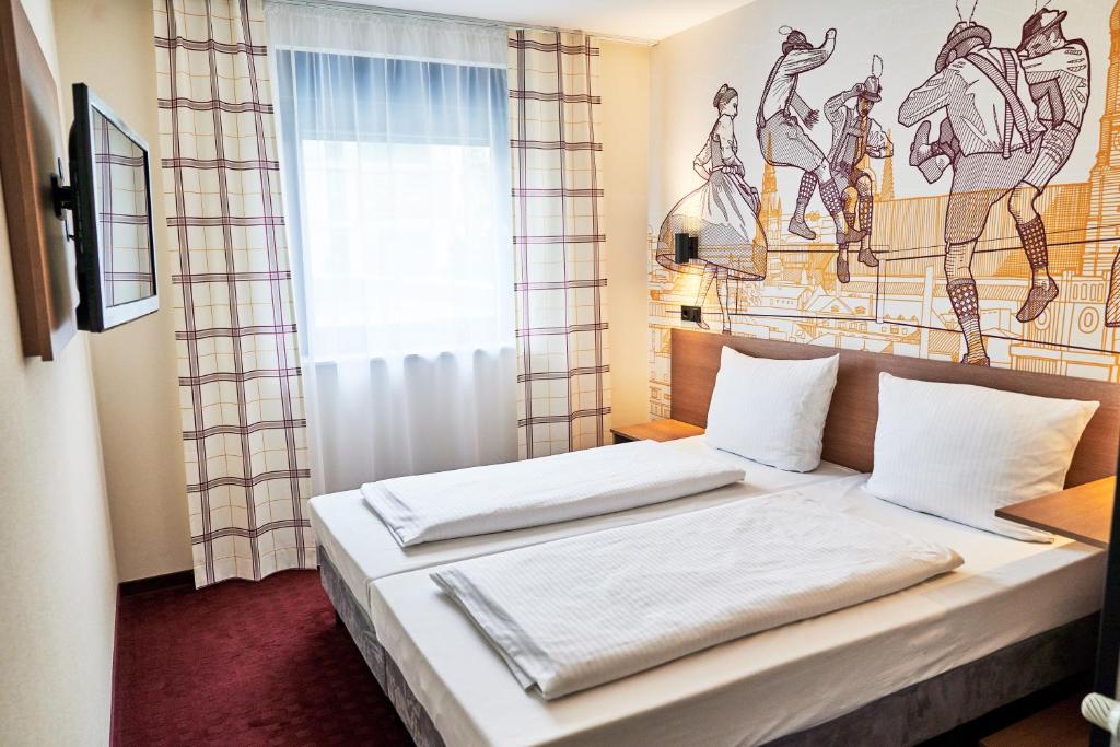 Postel nebo postele na pokoji v ubytování McDreams Hotel München - Messe
