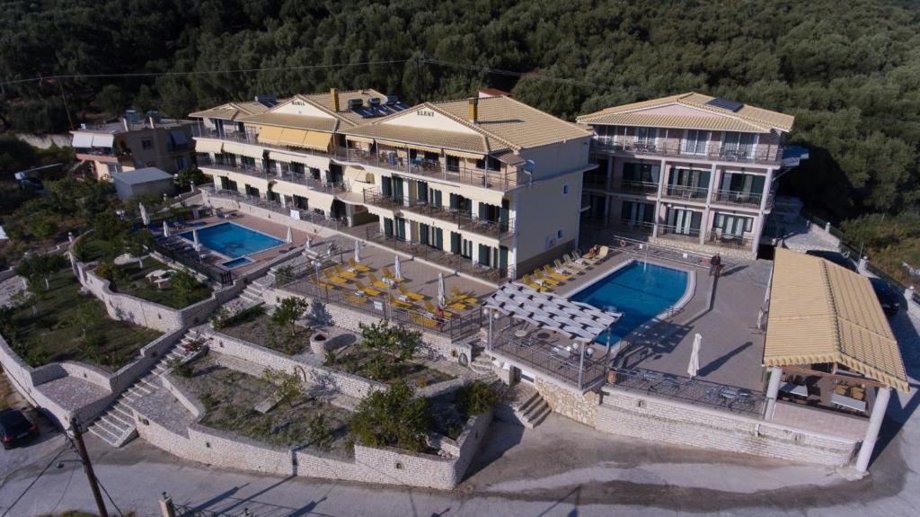 an aerial view of a large house with a swimming pool at Eleni Studios Parga in Parga
