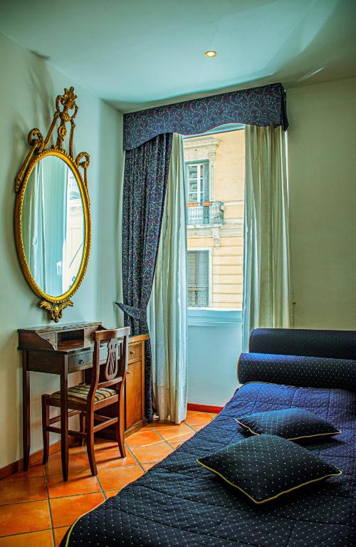 Cama ou camas em um quarto em Hotel Canova