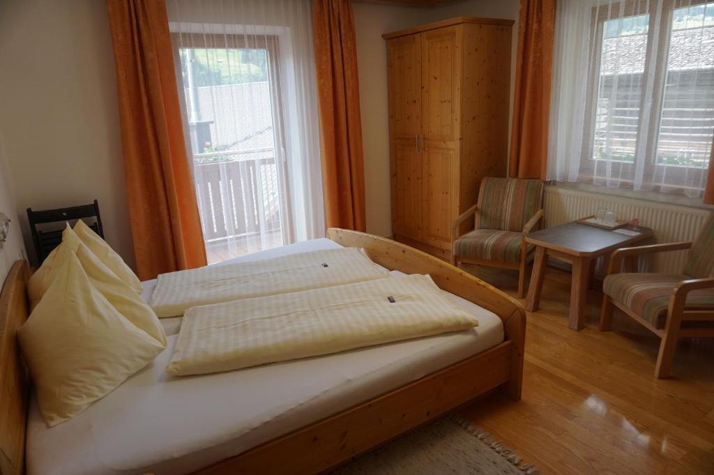 Postel nebo postele na pokoji v ubytování Musikhof Lexer