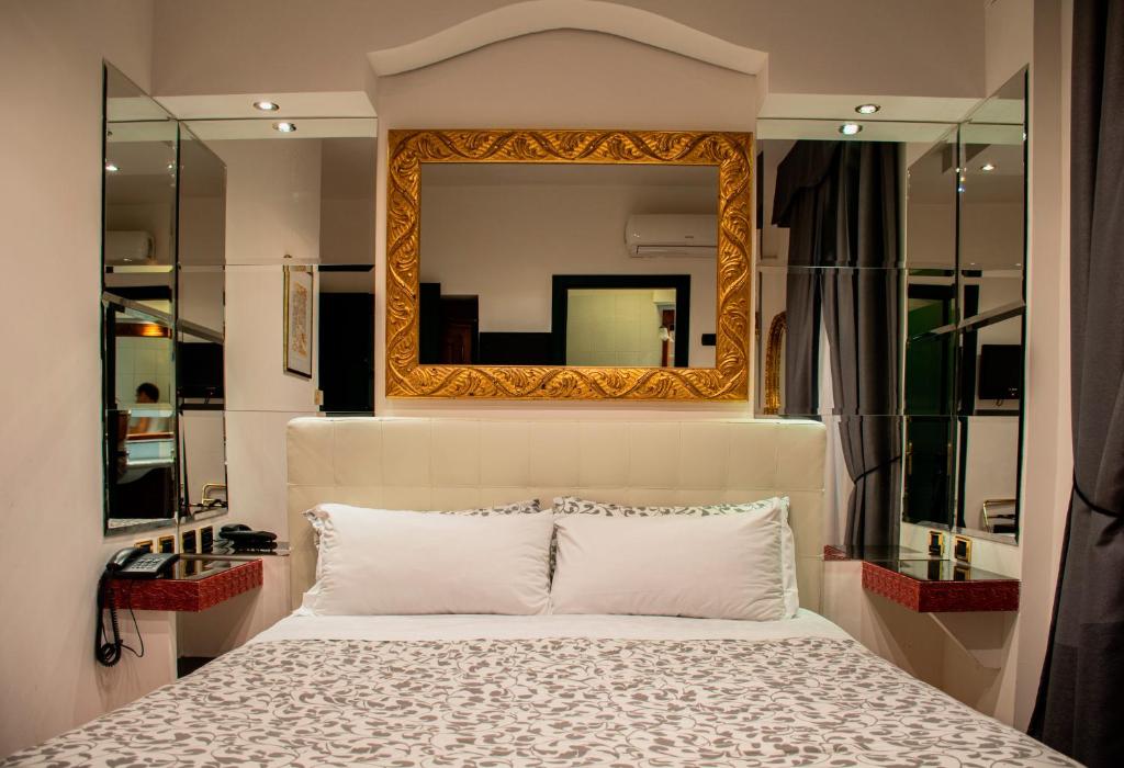 Cama ou camas em um quarto em Hotel Canova