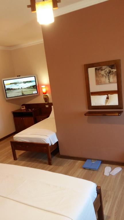 Postel nebo postele na pokoji v ubytování Drini Hotel