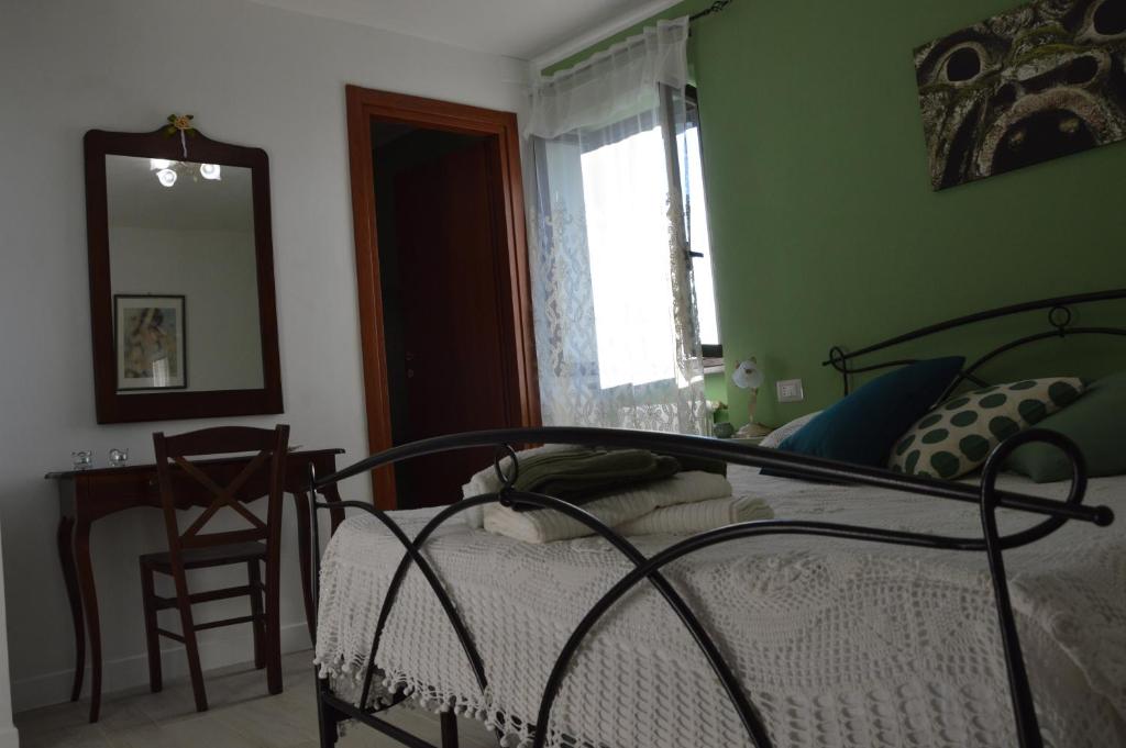 Letto o letti in una camera di B&B Il Grifo