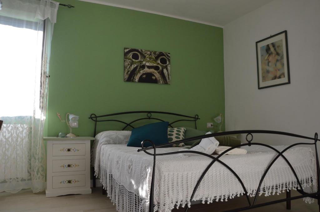 Letto o letti in una camera di B&B Il Grifo