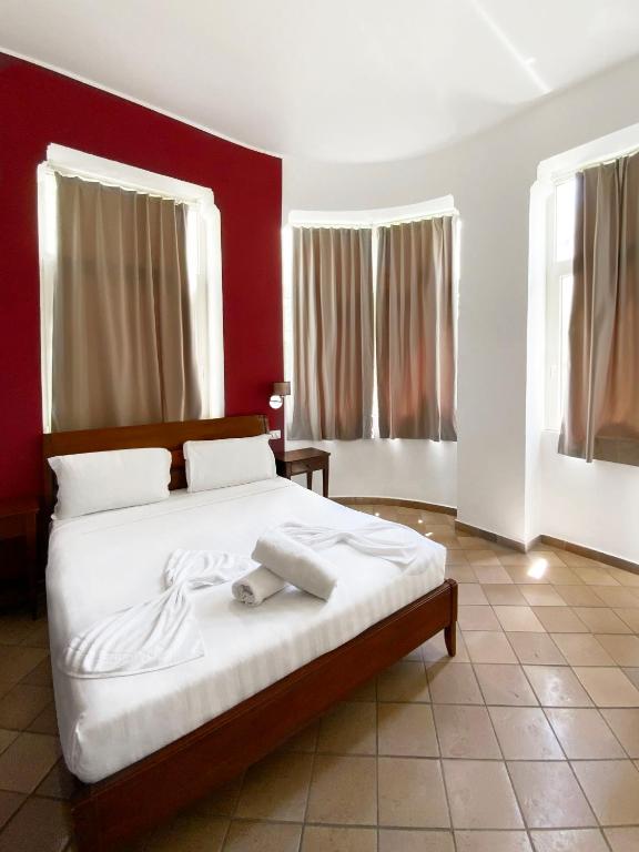 Postel nebo postele na pokoji v ubytování Roma Resort Colosseum