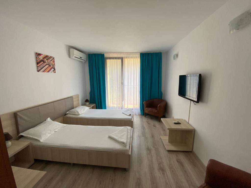 Postel nebo postele na pokoji v ubytování Q Hotel