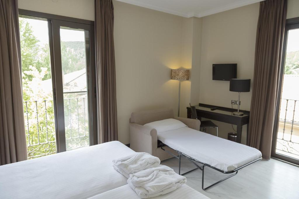 Posteľ alebo postele v izbe v ubytovaní Hotel Real Balneario Carlos III