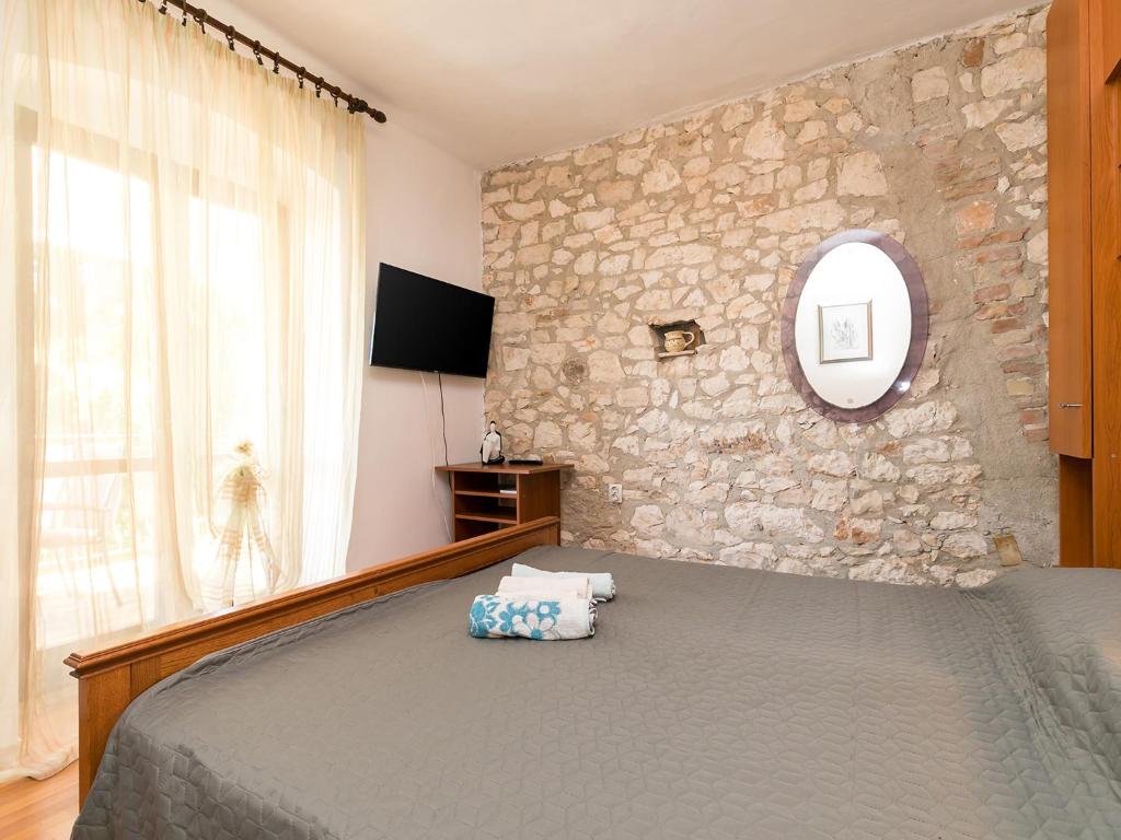 Postel nebo postele na pokoji v ubytování Apartman Šušnjić